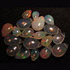 truly very rare - Ethiopian Opal - really - tope grade high quality smooth polished - pear briolett - huge size - 3x5 - 6x9 mm approx 19 pcs - each pcs - have amazing - beautifull - flashy fire all around in the stone approx STUNNING QUALITY - VERY VERY RARE